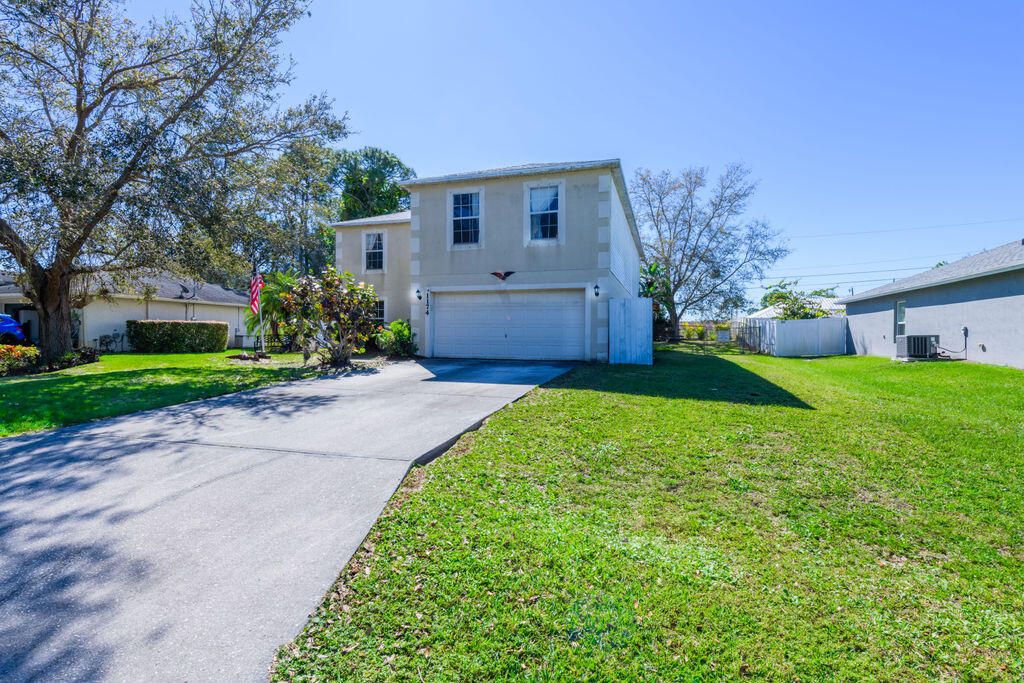 Photo of 1174 SW Babcock Avenue, Port Saint Lucie, FL 34953 (MLS # R10963300)