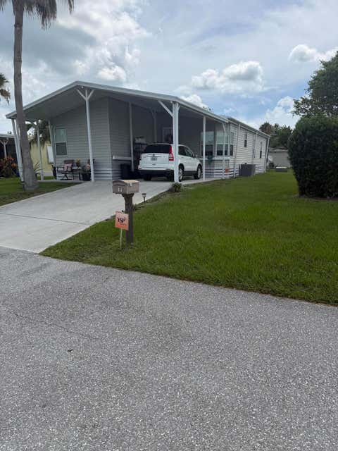 Photo of 11 Nuevo Leon Road, Port Saint Lucie, FL 34952 (MLS # B26049669)