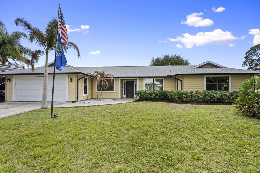 Space, flexibility, and true Florida living come together in this 4-bedroom, 3-bath pool home on a half-acre corner lot with over 2,400 square feet of living space and no HOA. This property offers the freedom to bring your boat, RV, and all your toys with ample parking, 50-amp hookup, water connection, and wide side-yard access. Major updates include a roof (2024), A/C systems (2021 and 2023), and a water heater (2022). Inside, 11+ ft vaulted ceilings create an open, airy feel, complemented by formal dining, and two separate living areas for added flexibility. The kitchen is dialed in for entertaining with granite countertops, stainless steel appliances, white cabinetry, and a pass-through to the patio. The primary suite provides a private bath and direct side-yard access, while the secondary bedrooms are generously sized with a clean coastal feel throughout. Step outside to a fully fenced backyard built to enjoy, featuring a wide covered lanai, dining space, and shed. The screened enclosure opens to a freeform pool with plenty of room to lounge. Additional highlights include hurricane roll-down shutters, Hardie plank siding, central vacuum, and a newer garage door. All just minutes from the Florida Turnpike, shopping, dining, and the C-24 Canal boat ramp for direct ocean access.