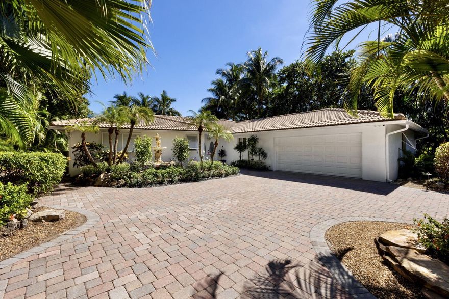 Welcome to 5 Barefoot Lane, Hypoluxo Island!  Wake up to stunning sunrises in this 3 bedroom, 2.5 bath private, waterfront oasis overlooking the beautiful Eau Hotel Resort & Spa, with a short stroll to both Manalapan Beach, and iconic ''Johnny G's'' or ''Dune Deck'' for breakfast.  Entertain in your heated pool and spa overlooking 80 feet of direct, wide-water intracoastal views, all within sight of your private boat dock with Ocean access.  Phenomenal natural light and water views throughout, with open concept floor plan, beautiful Brazilian hardwood floors, freshly painted interior/exterior, epoxy coated, 2 car garage, and more!  Recent, extensive installation of upgraded landscaping and new custom entrance gate (to be installed by end of 11/23).