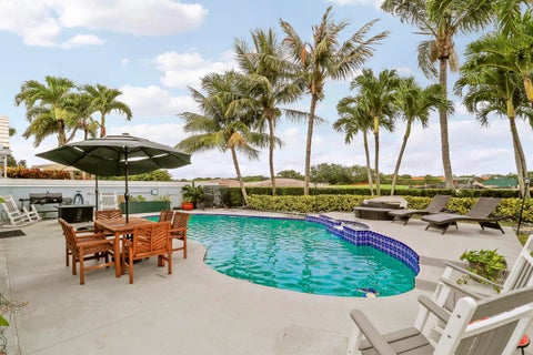 Photo of 1560 Wilderness Road, West Palm Beach, FL 33409 (MLS # B26037280)