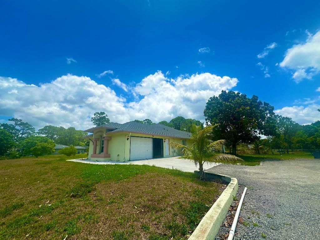 Photo of 14884 66th Street N, Loxahatchee, FL 33470 (MLS # R10993381)