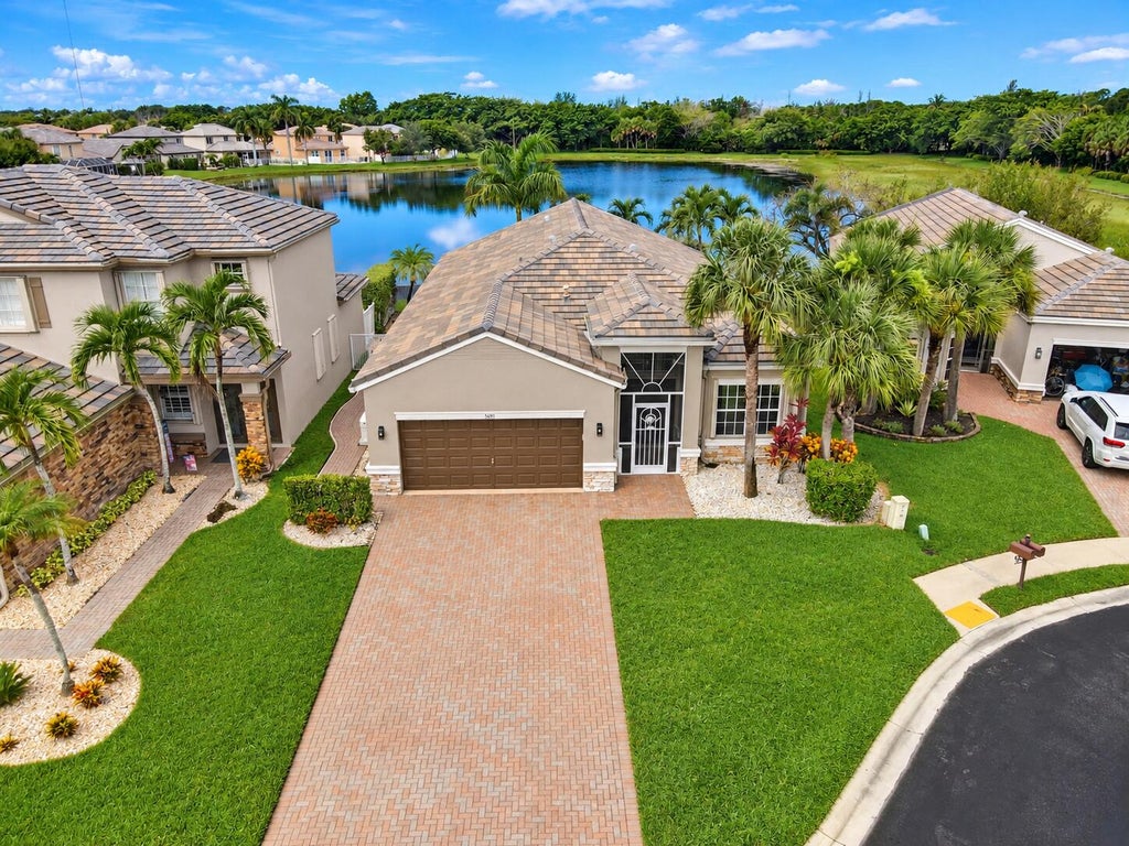 Photo of 5691 Saddle Trail Lane, Lake Worth, FL 33449 (MLS # B26074111)