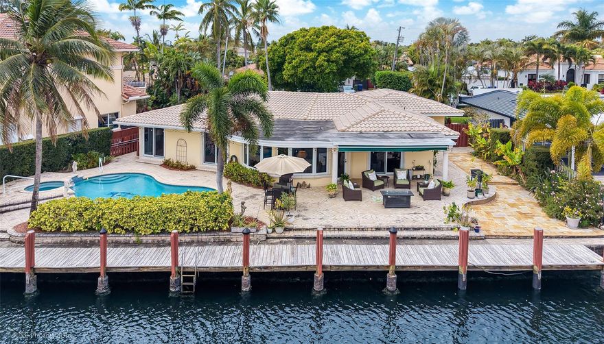 Rare waterfront opportunity on a quiet Wilton Manors cul-de-sac! This 3 bed/2.5 bath property offers 2,172 sq ft with 100’ of ocean-access frontage and expansive Middle River views. Light-filled living room with decorative fireplace, spacious family room overlooking heated saltwater pool, and dining with water views. Updated kitchen with KitchenAid appliances, remodeled baths, custom closets, whole-house filtration, impact windows/doors, 2-car garage, paver drive. Clay tile roof 2005 (sealed 2024), 2020 AC, 2019 water heater. 100’ dock resealed 2024, Aqualink system, landscape lighting, electronic awning, hurricane-rated garage door, ADT security, new garage flooring, two-zone sprinkler system, leaf-filtered gutters. There are a wealth of upgrades in this beautiful home. Come and see it!