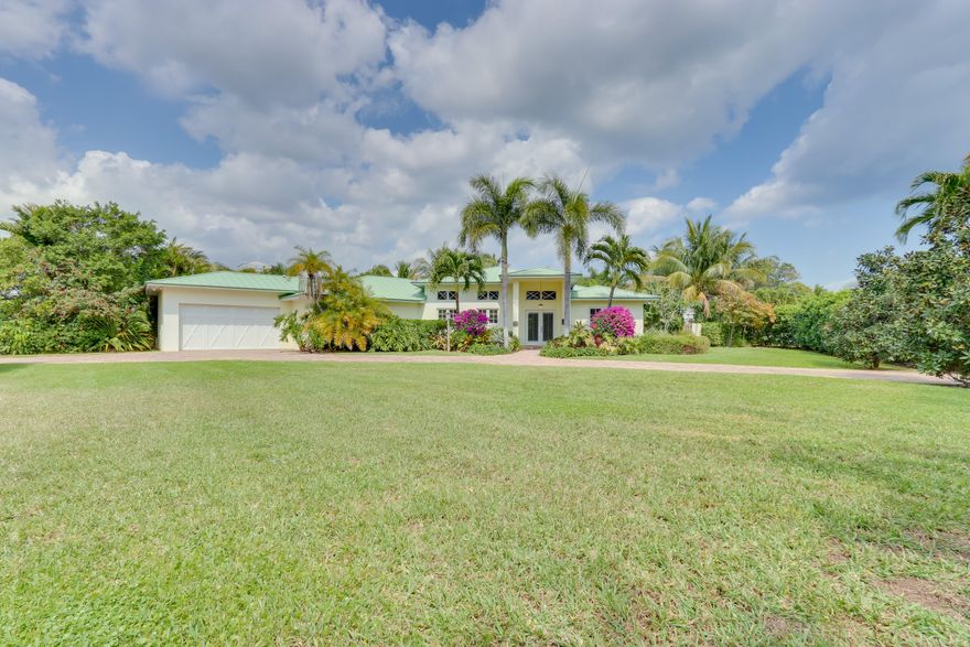 Fabulous Lake Ida estate full of Florida charm! Tucked behind a privacy hedge, this home is situated on a desirable corner lot & offers nearly 3000 sq feet of living space. 4 bedrooms plus spacious office, 4 bathrooms, 2 car garage and salt water pool complete with waterfall and hot tub. This tastefully renovated home features open concept main living spaces with extra high ceilings and desirable split bedroom layout. Bamboo flooring throughout and floor to ceiling custom built-ins in the living room. French doors open to the covered terrace, gorgeous pool, outdoor shower, and lush landscaping. Three bedrooms feature attached private baths. Master suite offers his and her walk in closets and spa like en suite bath. Desirable Lake Ida location just blocks to the beach and Atlantic Ave.