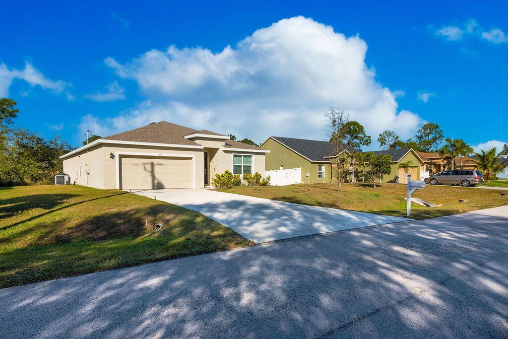 Photo of 3202 SW Martin Street, Port Saint Lucie, FL 34953 (MLS # R11159012)