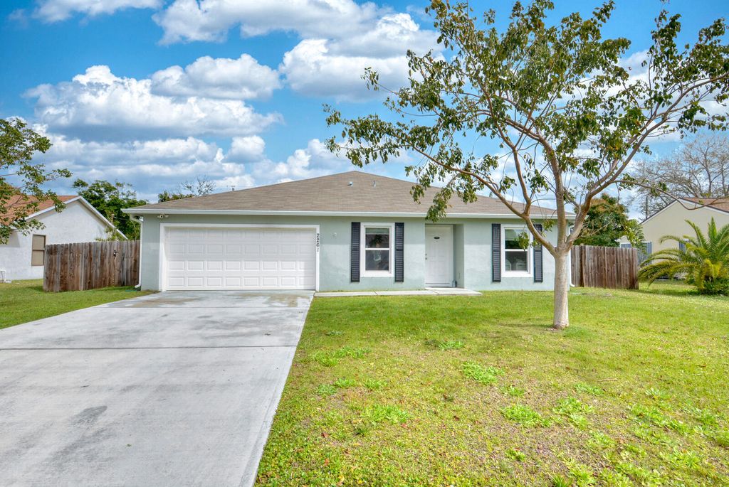 Photo of 2261 SE Gaslight Street, Port Saint Lucie, FL 34952 (MLS # R10961261)