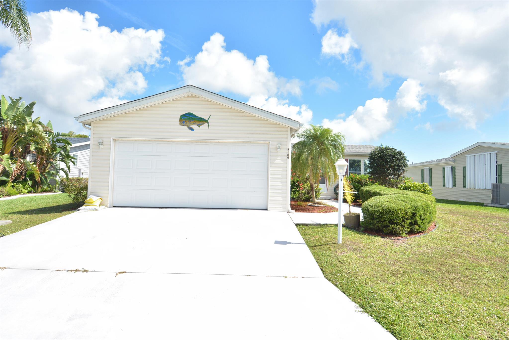 In the 55 plus community of the Savanna Club, 16 minutes from the beach we have for sale a 3 bedroom 2 bath 2 car garage with an enclosed lanai! SO many upgrades, real windows, stainless steel appliances,! This could truly be your home in paradise! This land lease property is ready for someone to make memories with!