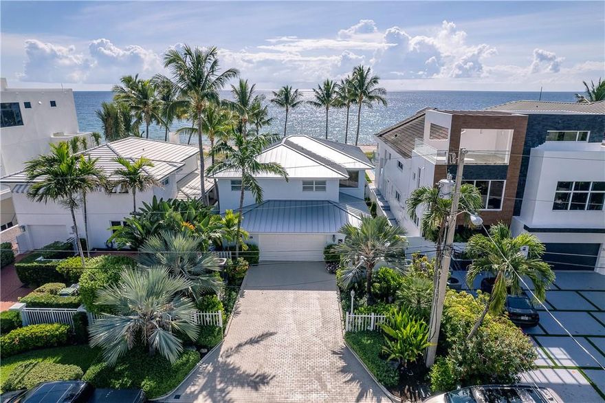 A rare opportunity to acquire a beachfront home directly on the sand of Fort Lauderdale Beach. This beautifully renovated residence is a 4 bedroom, 3 bathroom home with gorgeous ocean views from the formal living room, bar, kitchen, dining room, master suite and guest bedroom. Enjoy lounging oceanfront in the brand new, heated salt pool, under the covered patio or from the 2nd floor oversized balcony.Upstairs features a large master suite and 3 additional bedrooms. Additional highlights include a new metal roof, hurricane windows and doors throughout, laundry room, pantry, powder room & 2 car garage.This property is one of just 49 homes directly on the beach in a private enclave in the heart of Fort Lauderdale. Truly a must-see!