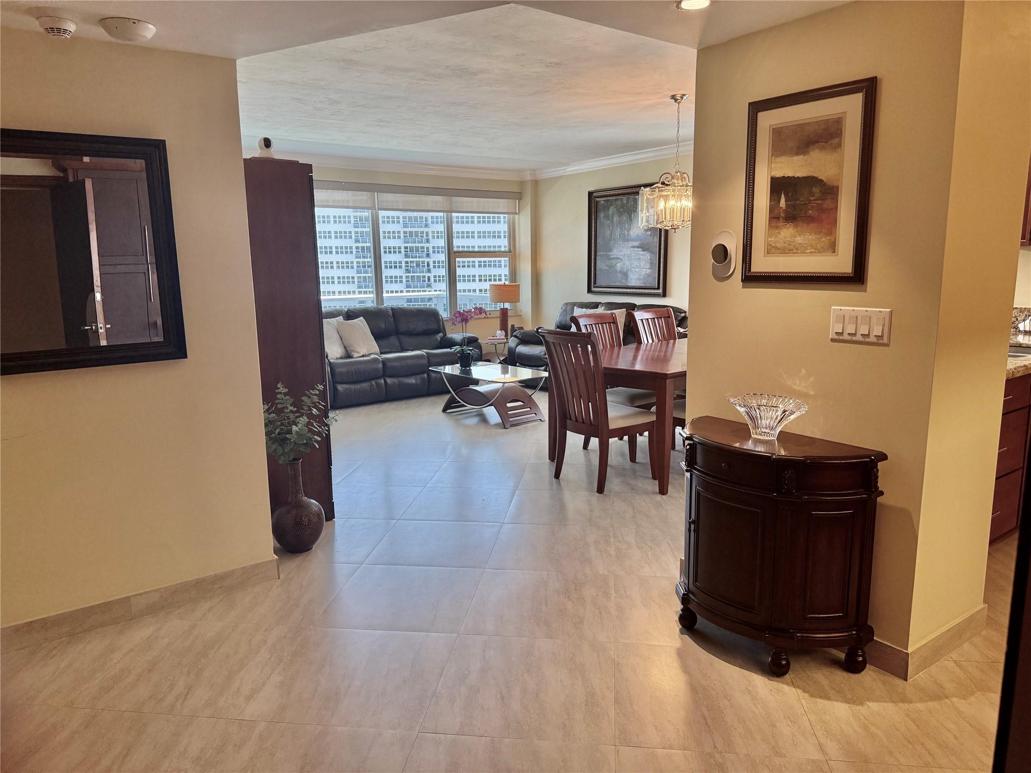 DISCOVER COASTAL LIVING in this meticulous 2BD/2BA unit overlooking THE POOL WITH VIEWS OF THE OCEAN,INTRACOASTAL & DOWNTOWN. Beautiful interior with spacious sunlit Living & Dining Room with full SOUTHERN EXPOSURE. OPEN CHEFS' KITCHEN, large Master Ensuite & Guest Bedroom make this THE PERFECT FULL TIME RESIDENCE OR WINTER GETAWAY. Unit is fully furnished in a warm neutral palette. Hurricane Windows & new Glass Balcony. All INSPECTIONS COMPLETED, All ASSESSMENTS PAID, FULLY FUNDED RESERVES and NO CONSTRUCTION. TURNKEY AND VACATION BEGINS DAY 1. Located directly across from the Beach in the infamous Galt Ocean Mile area surrounded by Grocery Stores, Shops, Restaurants, Cafes. Beautiful renovated Clubhouse w/ full kitchen on the INTRACOASTAL for gatherings and parties.. 55+ BLDG.