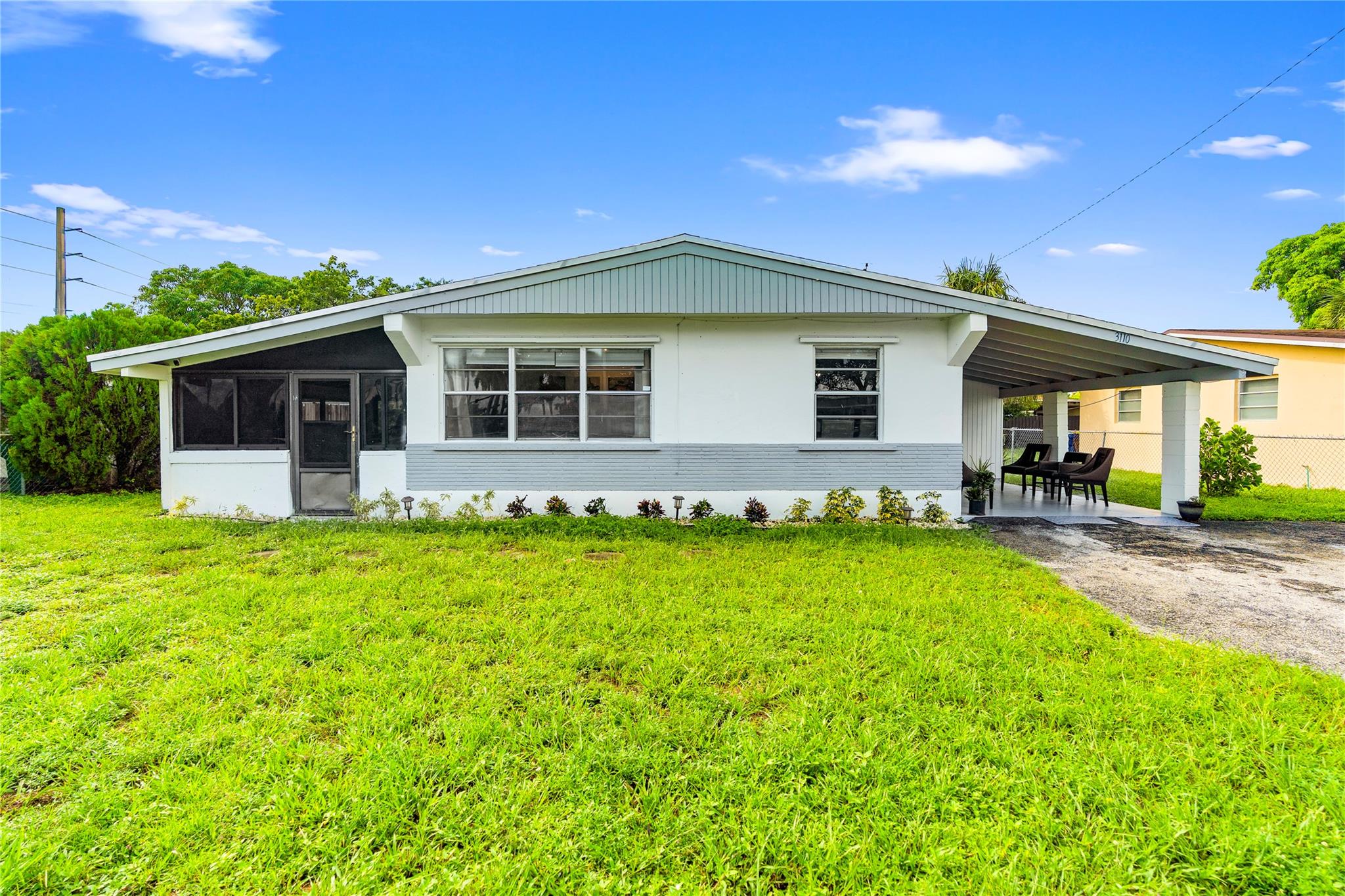 No HOA. This single-family home sits on an oversized lot with space to grow and endless possibilities. Updates include a newer roof (2021), a renovated bathroom, and all-new luxury vinyl plank flooring. The large front covered porch and covered carport enhance functionality while offering opportunities to expand square footage. Conveniently located, the property is 8 miles from Fort Lauderdale airport, 6 miles from both The Guitar Hotel at Seminole Hard Rock Hotel & Casino and the Fort Lauderdale beaches, and 2 miles from the Turnpike AND I-95.