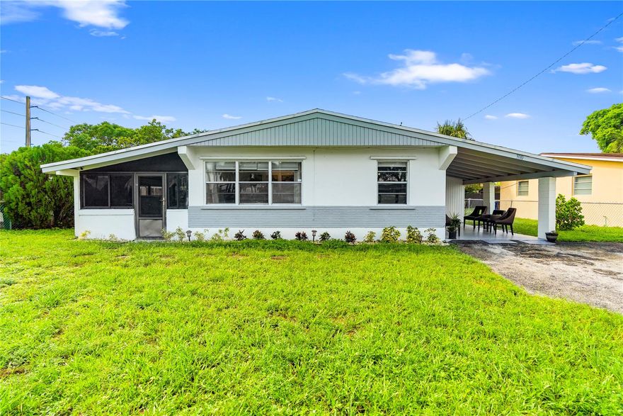 No HOA. This single-family home sits on an oversized lot with space to grow and endless possibilities. Updates include a newer roof (2021), a renovated bathroom, and all-new luxury vinyl plank flooring. The large front covered porch and covered carport enhance functionality while offering opportunities to expand square footage. Conveniently located, the property is 8 miles from Fort Lauderdale airport, 6 miles from both The Guitar Hotel at Seminole Hard Rock Hotel & Casino and the Fort Lauderdale beaches, and 2 miles from the Turnpike AND I-95.