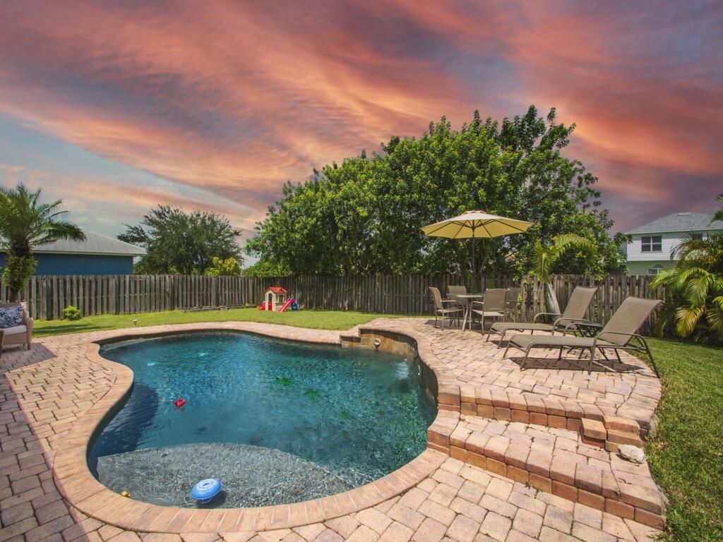 Photo of 6031 NW Wolverine Road, Port Saint Lucie, FL 34986 (MLS # R10744420)