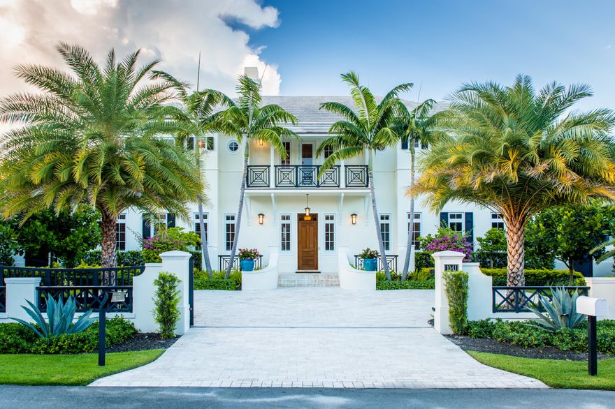 A Grand Bermuda Style Residence newly constructed in 2013. Prominently located in Delray Beach's distinguished North Beach enclave on a private cul-de-sac street with direct access to the pristine beach. The street to street parcel allows for a gated courtyard entry and a separate rear motor court with three car garage. A spacious great room plan with voluminous twelve foot ceilings throughout, the 20 ft. floor-to-ceiling pocket doors offer a seamless flow between indoor and outdoor living. A five bedroom, five and two half bath versatile layout including a chef's kitchen, elevator, luxurious master wing, and ample guest bedrooms. A deep relaxation loggia and covered veranda wrap the back of the home.The inviting pool and spa, built-in fire pit and outdoor kitchen create a private trop