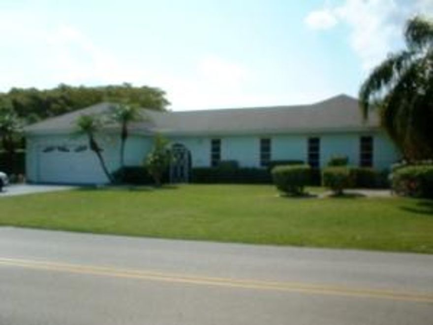 When entering the walk way area you will be pleased with the atrium that is screened in along with sliding glass door that leads into other bedrooms. The garage has closet space with additional cabinets and wall unit. The kitchen has open floor plan with extra counter space. There are two living rooms that leads out to patio by sliding glass doors. Bedrooms all have wood flooring. The Master bedroom closet is in an L Shape and has been customized. Master bath has double sinks along with a Roman tub and separate shower. Long hallway to divide bedrooms and has sliding door in hallway for separate entrance. Extended Screen patio with two door exits that overlooks golf view.