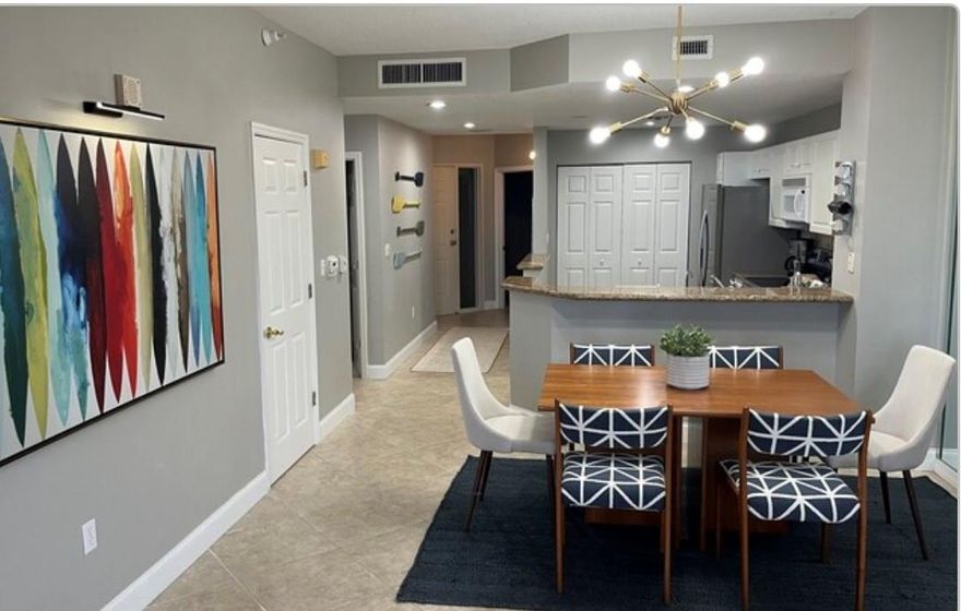 This spacious oceanfront condo features an open-concept design and a large balcony that opens directly to the walkway leading to the heated pool, spa, and private deeded beach. Beautiful ceiling fans are featured in every room. The unit may be sold furnished or unfurnished. Enjoy resort-style amenities including a fitness center, tennis and pickle ball courts, club room, fishing dock, and kayak launch. The association is exceptionally well run with strong reserves. Includes a one-car garage. **Seller Very Motivated. Owner financing available.**Sellers willing to lease back apartment from buyer for 6-9 months after sale.