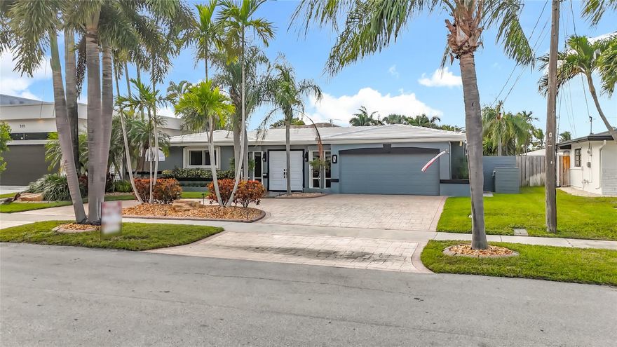 Located in Garden Isles Subdivision, This Waterfront 3 BR/ 2 BA Pool Home w/ office (optional 4th BR) Features: A Brand-new metal roof to be completed December 2025, brand new LVP flooring, new AC unit and electrical panel 11/25.  Enjoy 70' of waterfront and 65' of dock with ocean access and 1 fixed bridge (12 ft clearance) to the intercoastal waterway.  Backyard is a private, tropical retreat w/ 30x15 ft kidney shaped pool heated w/ spa, lush landscaping, outdoor shower, 19ft tiki hut w/ 7 ft bar and sunshade. Impact windows, doors, garage, accordion hurricane shutters, whole house generator, nat gas, and smart exterior lighting. Garage under AC and large attached shed. Short drive to the beach, Pompano airpark, equestrian stables, parks and more. More than a home, it's a lifestyle.
