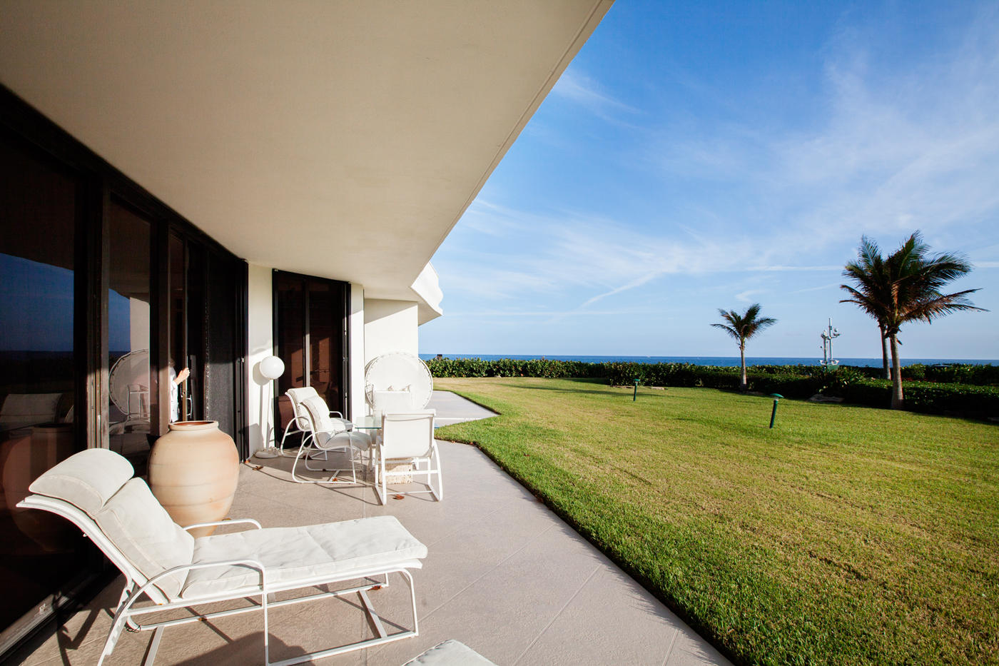 Lovely Southern Views of the Ocean from large lanai. Lives like a private home. Walk to Ocean and pool. Spacious apartment with high ceilings, marble floors, and many designer upgrades. Sought after condominium complex includes gatehouse, doorman, pool attendant, 2 space garage parking, and tennis center with pro. Newly designed lobby. Close to Worth Avenue, restaurants, and cultural centers. Resort living at its finest!
