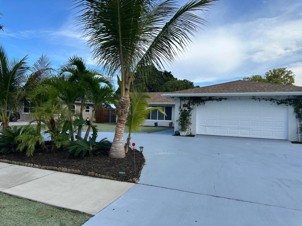 Photo of 528 Date Palm Drive, Lake Park, FL 33403 (MLS # B26047694)