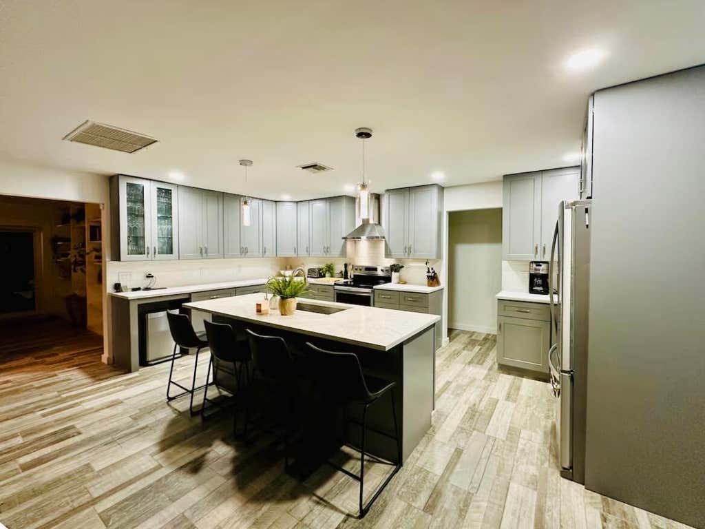 Photo of 528 Date Palm Drive, Lake Park, FL 33403 (MLS # B26047694)