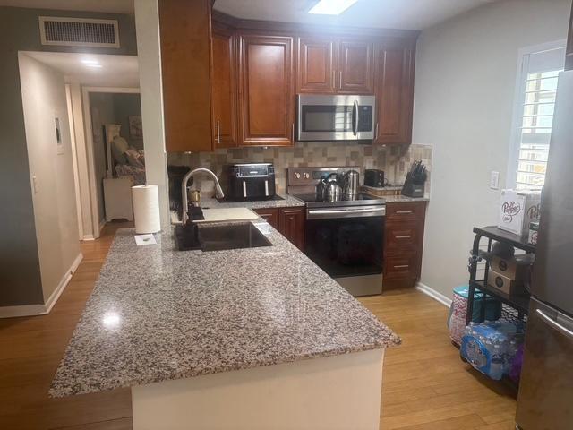 Welcome to this bright and beautifully updated 2-bedroom, 2-bath condo located in the highly desirable 55+ community of Kings Point in Delray Beach. This move-in ready unit features a modern kitchen with granite countertops, stainless steel appliances, and custom cabinetry. The open-concept living and dining area is perfect for entertaining and leads to a spacious screened-in balcony--ideal for enjoying your morning coffee or evening breeze.Both bedrooms offer ample closet space, and the bathrooms have been tastefully renovated with walk-in showers, stylish tile work, and contemporary finishes. Enjoy tile or luxury vinyl flooring throughout, updated lighting, and an in-unit washer and dryer for your convenience