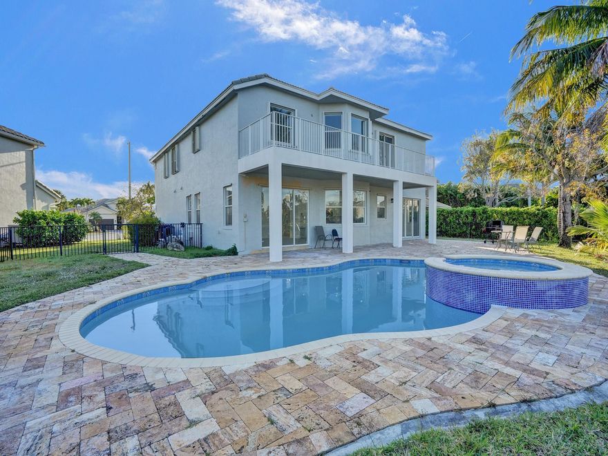 Stunning 6-bedroom 4-bath modern haven nestled in the heart of wellington.  Located on a cul de sac with large pie lot with gorgeous lake views from every angle. The expansive floor plan seamlessly blends functional living spaces with refined aesthetics. Newly updated flooring throughout the entire home. Updated Gourmet kitchen with brand new SS appliances, quartz countertop, custom cabinetry, beautiful island, walk-in pantry. Luxurious master suite featuring serene ambiance, a spa-like new ensuite bathroom.  The backyard is a private oasis,pristine pool-jacuzzi, creating an outdoor retreat. Located near upscale shopping, dining and top rated schools. State-of the art recreational amenities, ultimate in convenience and lifestyle. Don't miss out!! Must see!
