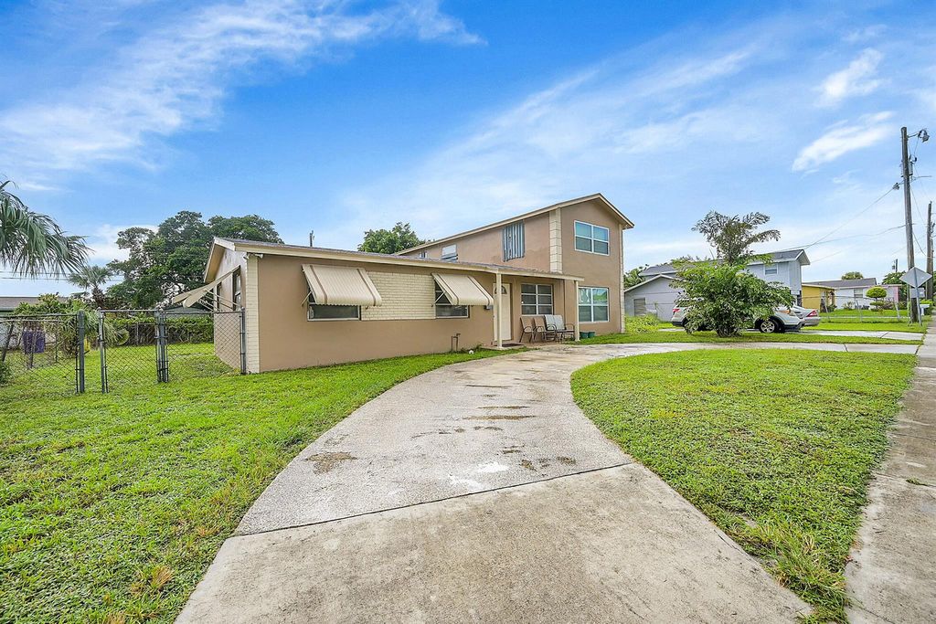 Photo of 1445 W 34th Street, Riviera Beach, FL 33404 (MLS # R11015242)