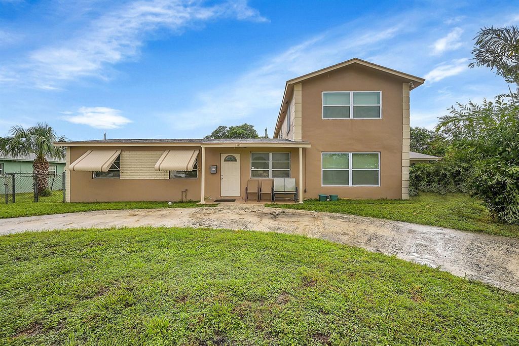 Photo of 1445 W 34th Street, Riviera Beach, FL 33404 (MLS # R11015242)