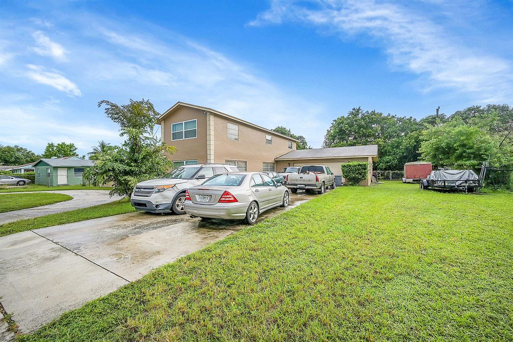 Photo of 1445 W 34th Street, Riviera Beach, FL 33404 (MLS # R11015242)