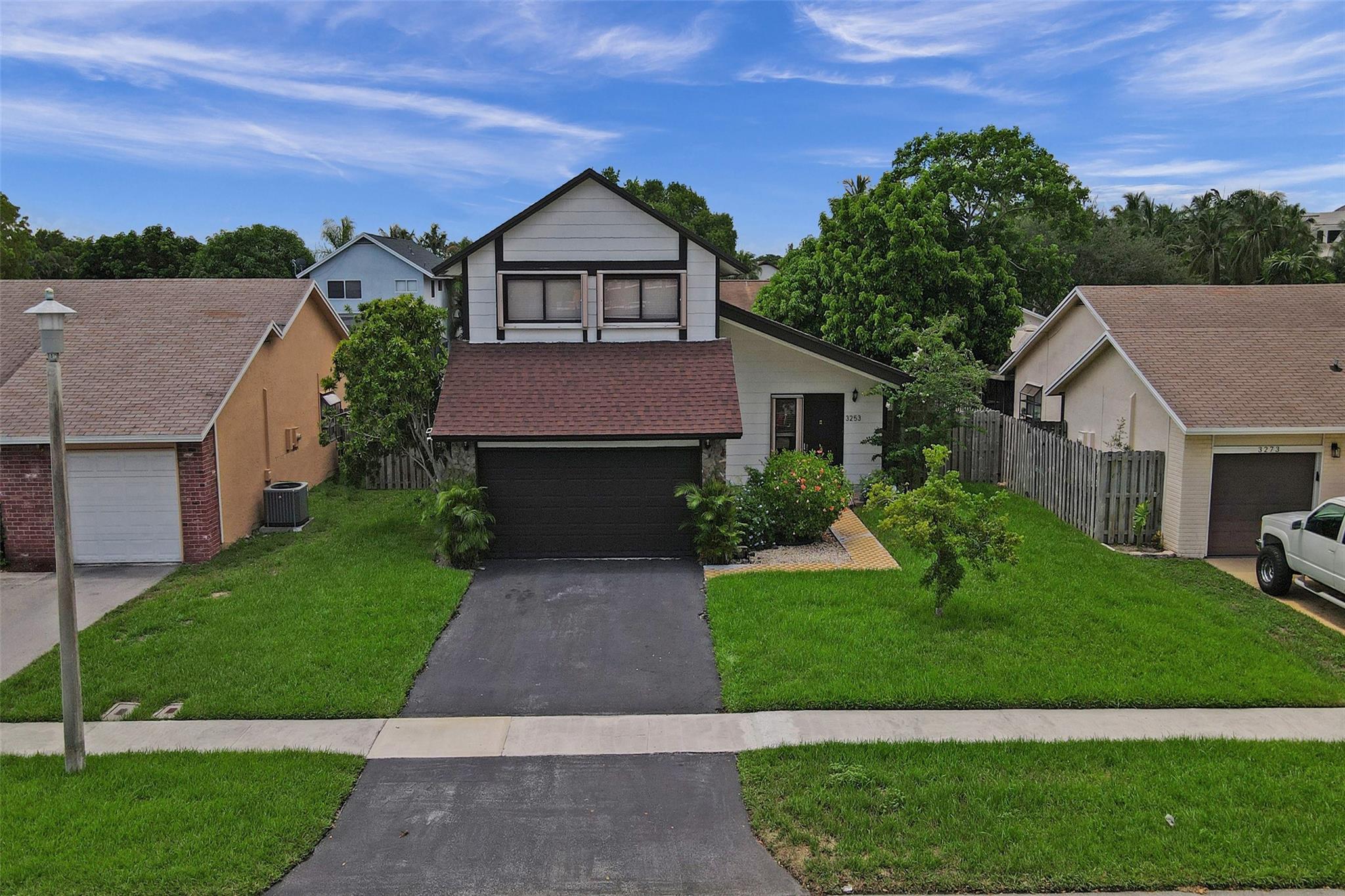 Beautifully updated 3-bed, 3-bath split-level home with 2-car garage and over 1,500 sq. ft. of living space. Features include a 2022 shingle roof, new vinyl flooring, granite kitchen with stainless steel appliances, and updated bathrooms with a double vanity in the primary suite. Enjoy new custom closets, a full bath on the main floor, and a newly added Pegula for shaded outdoor living with a large lot! Accordion shutters throughout. Low quarterly HOA fee with access to Welleby Palms Park. Minutes from Sawgrass Mills, BB&T Center, and more. Easy to show—don’t miss this one!