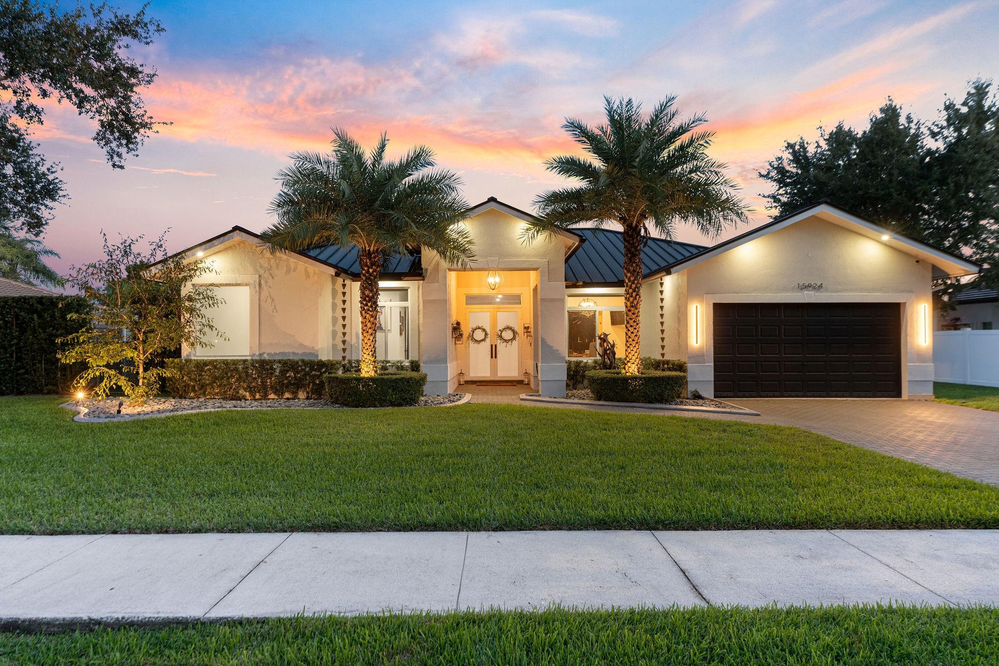 Located in the gated community of The Enclave, this completely remodeled 4-bed, 3-bath home plus office is truly turn-key. Every detail has been upgraded—new metal roof, impact windows, beautiful new floors, and a stunning chef’s kitchen with a large granite island. The open floor plan is perfect for family living and entertaining, flowing seamlessly to the outdoor oasis featuring a brand-new pool, spa, and tiled patio. Enjoy upgraded bathrooms, an AC-equipped garage, and a full security system with cameras. Style, comfort, and functionality—this home has it all.