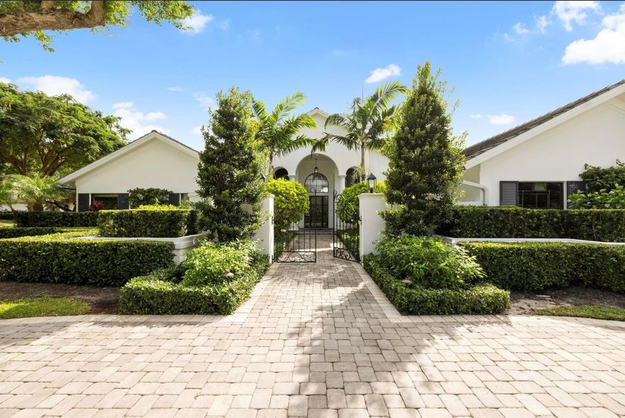 Experience refined Florida living in this fully renovated 1.03 acre single story custom home, totally rebuilt from the inside out. With over 5,000 sq. ft. of living space, this residence offers 4 private bedroom suites, 6 baths, a library-style office with custom built-ins and an upper reading nook, a bonus/game room, and a 4-car split garage.Perfectly positioned on the corner of the cul-de-sac, the home is surrounded by lush, fully reimagined landscaping that enhances both curb appeal and privacy. The property now features an expansive new decorative circular driveway, designed to allow generous parking and smooth flow for residents and guests.