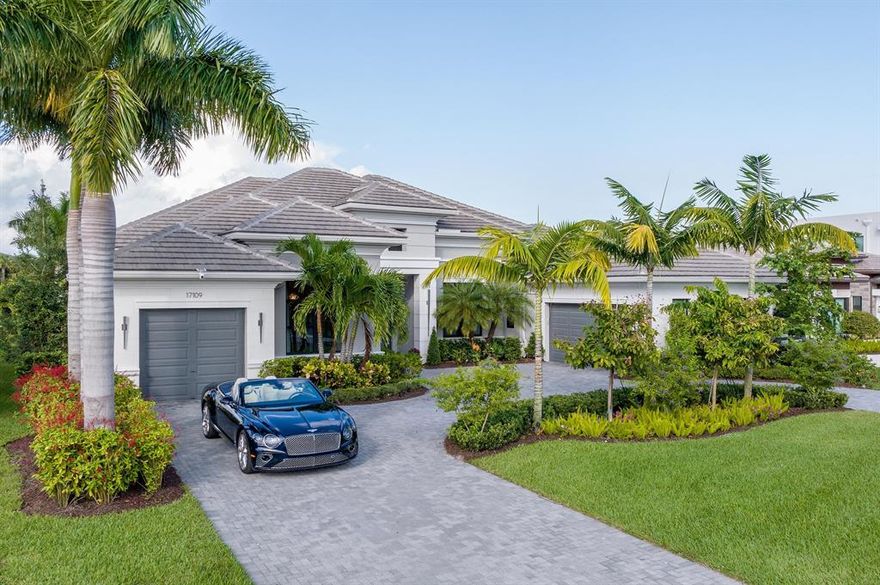 17109 Brulee Breeze Way. As if celebrating the good life inside one of South Florida's most celebrated luxury communities isn't already enticing enough, this coveted model at prestigious Boca Bridges further captures the imagination with design that's both striking and inviting. The thoughtfully conceived 5,980-square-foot layout, one of just a handful of Belvedere Transitional models, dazzles with waterfront splendor, clean lines, custom details and brilliantly rendered spaces. Each curated room complements the next with a thread of sophistication and comfort, starting with a spacious great room that boasts soaring ceilings and a decorative fireplace. The four-bedroom layout (with five full baths and one-half bath) also features a family room, formal dining room, media room, club room...