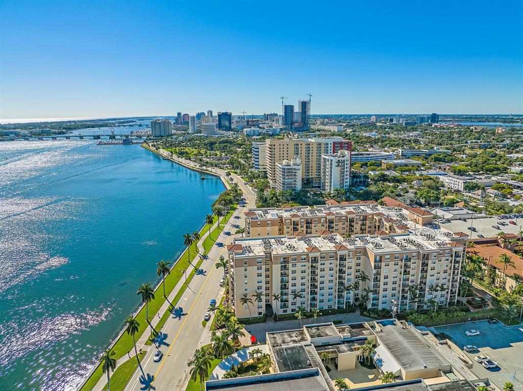 Florida Coastal Living, Directly Across from the Intracoastal Waterway Conveniently located on the first floor of the Flagler Pointe Building. Assigned Covered Parking space within steps of your home. First Floor Level Features 9ft Ceilings.2/2 Spilt Bedroom.Quality wood-like tile throughout the main living areas. Spacious kitchen opens to the dining and living areas.Sliding doors lead to your private garden patio. Hurricane impact windows and doors. Minutes to Palm Beach Island and local Beaches. One mile North from Downtown West Palm Beach. Flagler Pointe includes hotel like amenities, such as 24 hour concierge service, gated entry, 24 hour security service, resort style pool, spa and clubhouse area, outdoor kitchen and grilling, full gym, office, Bike storage.