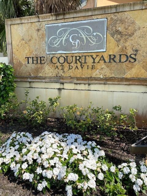 Secluded corner unit with private entry in the COURTYARDS at DAVIE! This spacious first-floor unit features a large kitchen and living area and a private patio perfect for entertaining. The comfortably sized bedrooms have plenty of closets and storage space. The unit is located directly across from the tennis courts. Other amenities include a clubhouse, pool, and hot tub, all in a gated community. It is located just around the corner from Nova Southeastern University, Florida Atlantic University, and other great schools in the Davie area.