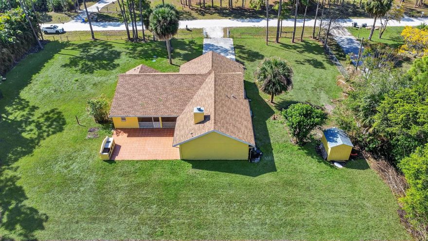 Beautiful 4 bedroom 3 bath single family home situated in the highly desirable acreage community of Loxahatchee.  This spacious 3 way split home features a 2024 Roof and offers approximately 2,300 square feet of living space with a functional floor plan, generous living areas and a 2 car garage. Enjoy peaceful country-style living with no HOA and plenty of room for outdoor entertaining, gardening, or storing Boats, RVs, and other toys. The large lot provides privacy and space while still being conveniently located near A rated schools, shopping, dining and major roadways.