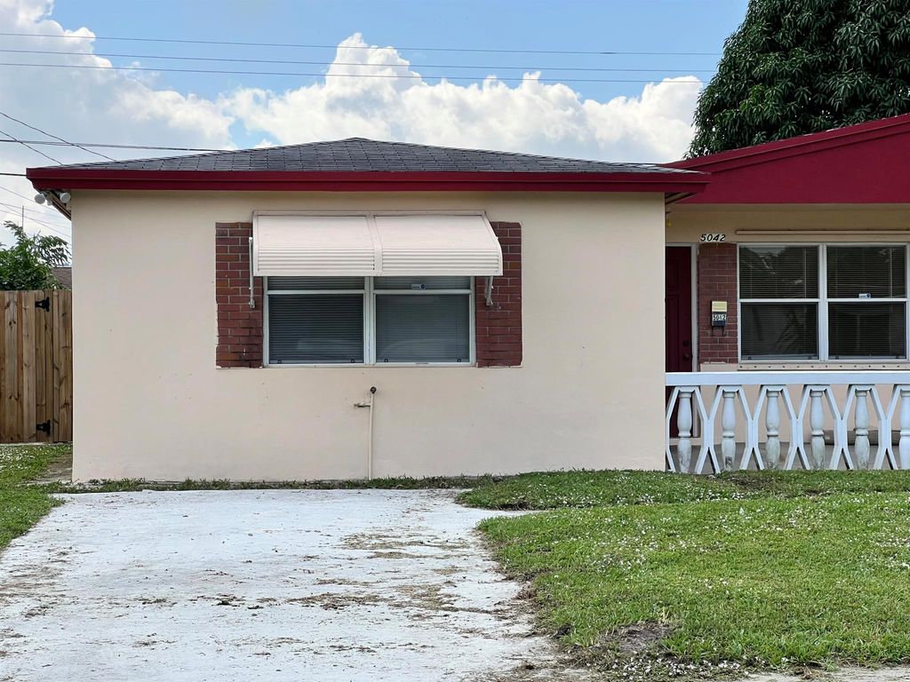 Photo of 5042 Eadie Place, West Palm Beach, FL 33407 (MLS # R10973866)