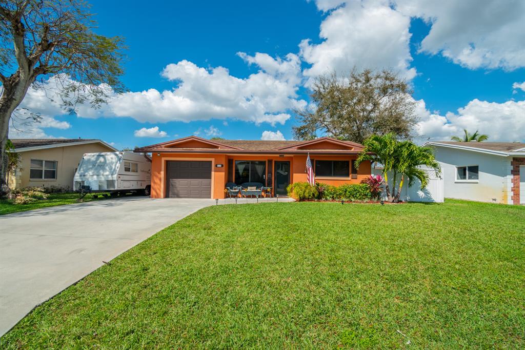 Beautiful 3 bedroom 2 bathroom single family home in Palm Aire! Large fenced in backyard with expanded brick paver patio with a nice pergola for shade during the hot summer. Kitchen features stainless steel appliances. IMPACT WINDOWS! This home won't last!!!