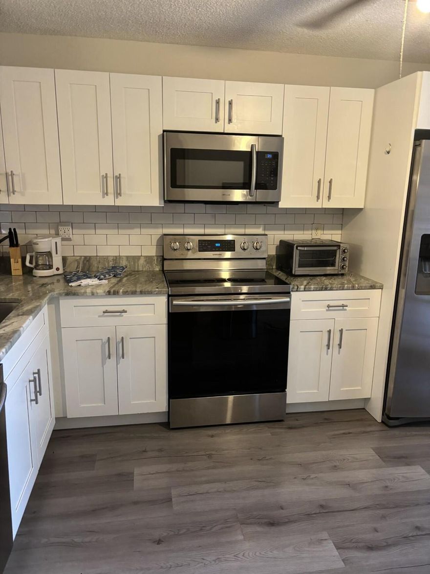 Enjoy relaxed coastal living in this beautifully updated first-floor, 2-bedroom waterfront condo located just 2 miles from the beach. The home features a granite kitchen, fireplace, and spacious living areas with tranquil water views. Pets are welcome with no weight limit. Community amenities include a pool and convenient access to nearby shops, dining, and Boca's beaches.A one-month minimum rental is required.