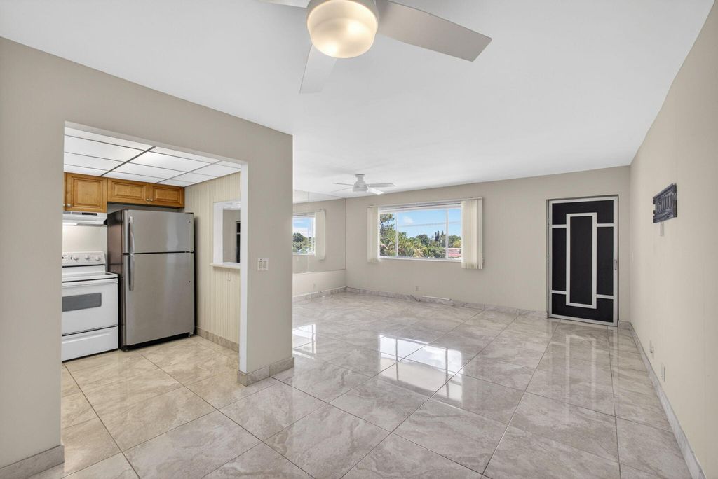 Photo of 300 S Village Green Cir Circle S #420, Palm Springs, FL 33461 (MLS # B26026614)