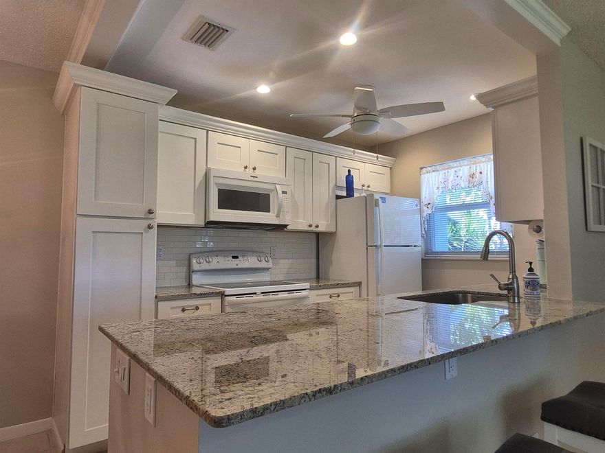 :Beautifully updated 2-bedroom, 2-bath corner villa in the 55+ community of High Point Delray. This light-filled home features an open and inviting layout, perfect for entertaining. The remodeled open kitchen includes shaker-style cabinets, granite countertops, modern finishes, ample counter space and lots of drawers for the at home chef. Both bathrooms have been renovated, showcasing sleek tile work and glass-enclosed showers. Additional highlights include impact windows throughout for safety and efficiency, spacious bedrooms with great closet space, and a Florida sunroom ideal for lounging or a home office. Enjoy the quiet setting with a large yard. Positioned across the street to the Clubhouse and Pool. Located just minutes from downtown Delray, shopping, and beaches. Schedule today!!