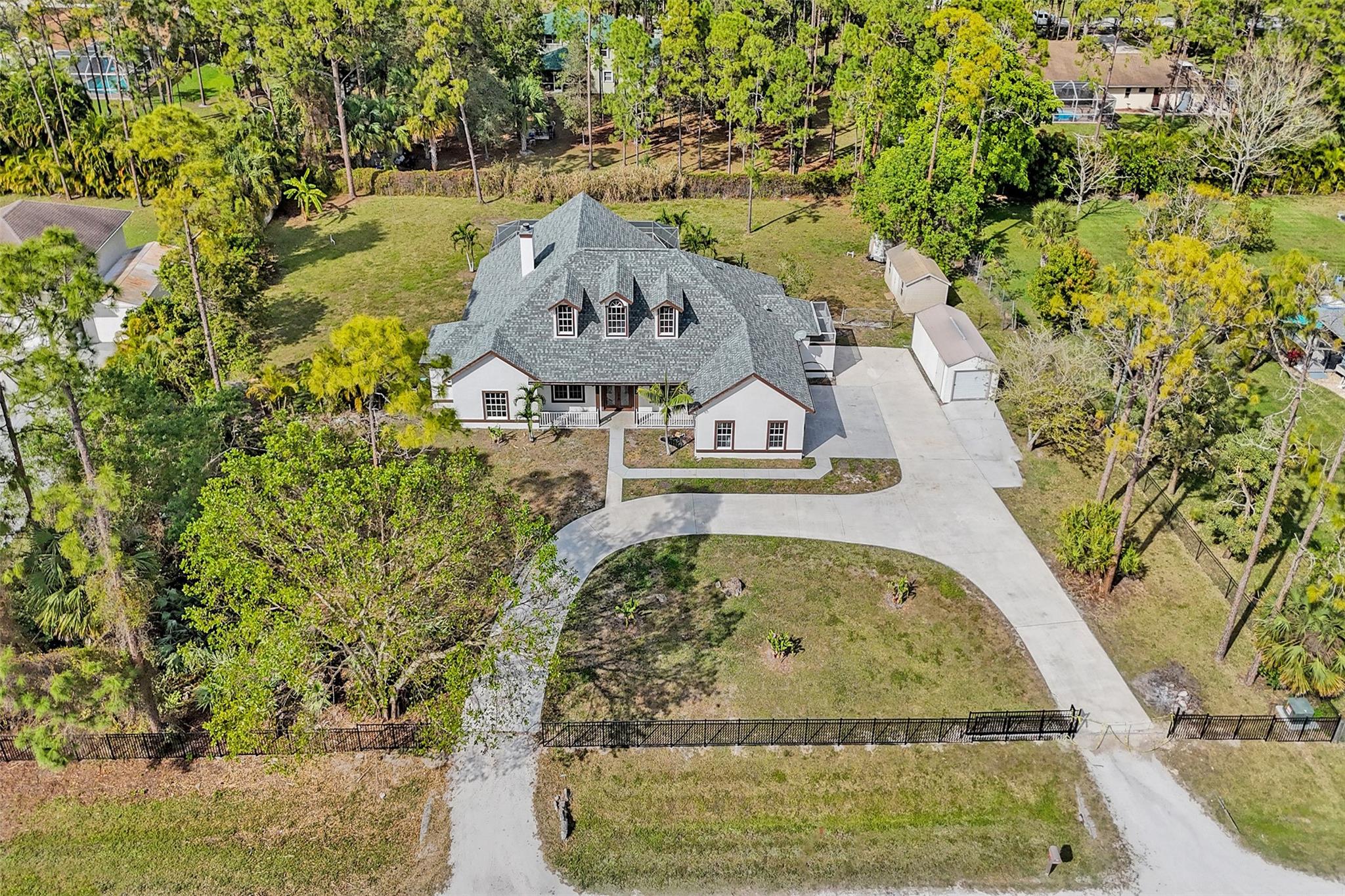 BROKERS, PLEASE BROKER REMARKS..... FULLY UPGRADED 6 BEDROOM, 4 BATHROOM, 3 CAR GARAGE LUXURY HOME. 2023 ROOF AND 2022/2023 ACs . UNIQUE FLOOR PLAN WITH 4/3 BED/BATH DOWNSTAIRS WHERE AS 2/1 BED/BATH WITH SEPARATE FAMILY AREA/LOFT ON THE SECOND FLOOR. BRAND NEW KITCHEN PLUS ALL BATHROOMS HAVE BEEN RECENTLY REMODELLED AND THE HOME ALSO HAS BRAND NEW FLOORS. MASTER BEDROOM ON 1ST FLOOR WITH COFFERED CEILINGS AND SPACIOUS BATHROOM WITH 2 SIDED WALK IN SHOWER WITH RAINMAKER SHOWER HEAD AS WELL AS GIANT STAND ALONE LUXURY TUB. SCREENED IN POOL WITH LOTS OF ENTERTAINMENT AREA, 2 ZONED A/C UNITS & 2 WELLS. ENJOY THE OUTDOOR ON OVER AN ACRE OF FENCED IN LOT. FEEL FREE TO BRING YOUR HORSES, OTHER PETS, BOATS AND TOYS. 2 LARGE SHEDS ON THE PROPERTY OFFER ADDITIONAL STORAGE/WORKSHOP OPTIONS.