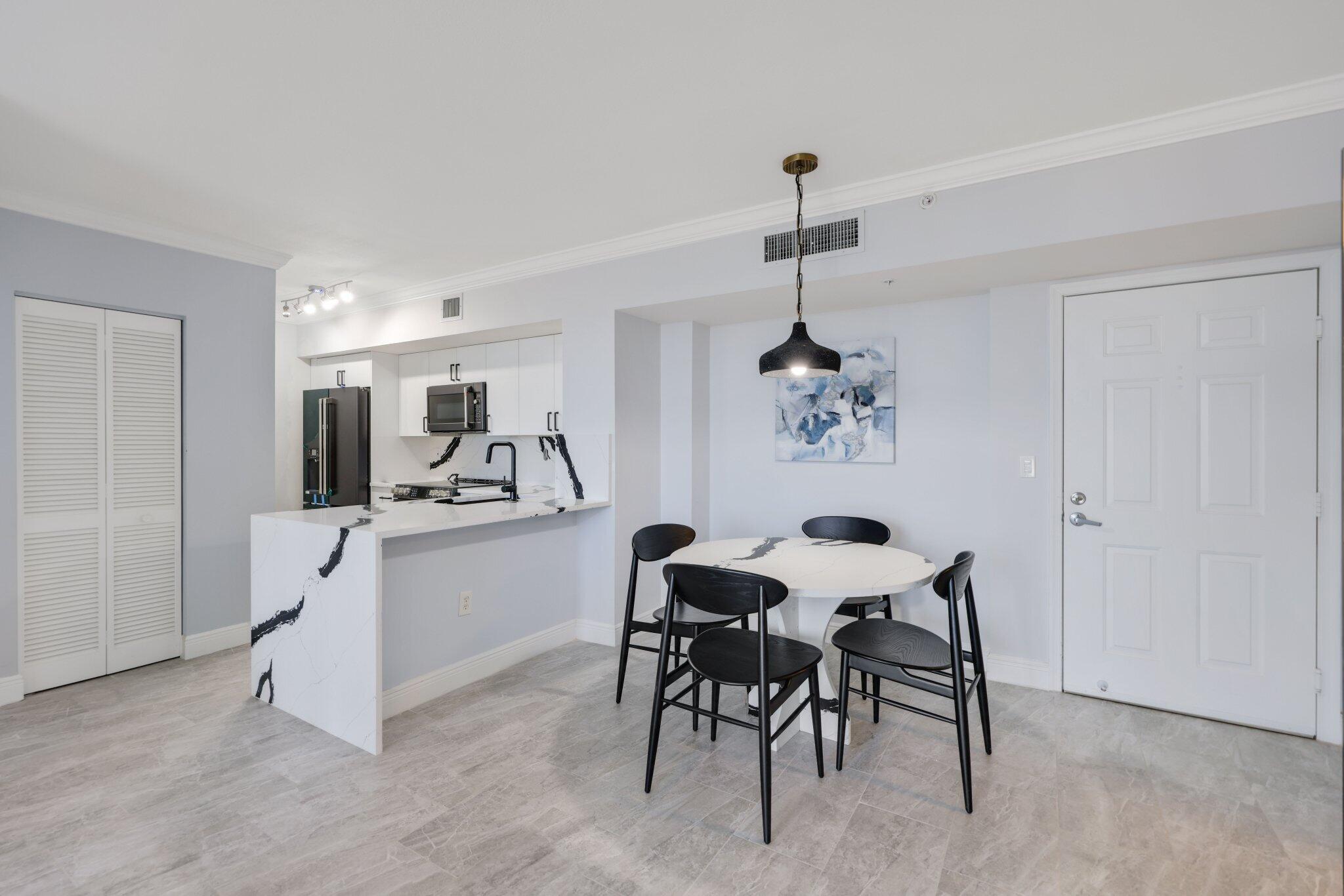 Welcome to this stunning 2-bed 2-bath condo at the gorgeous Tower Condominium in the heart of downtown West Palm Beach. This unit has been renovated top to bottom with the utmost care and attention to detail and not lived in or used for a single minute since the renovations were finished. The gorgeous kitchen with waterfall countertops is complemented by tasteful tile flooring throughout. Spacious bedrooms with built out California Closets are accompanied by beautifully done bathrooms. Tower Condo has gone through recent improvements including brand new impact windows and doors, a new roof, concrete restoration, and building paint. This special assessment will be paid in full at closing allowing you as the new buyer to enjoy these upgrades at ZERO expense to you.
