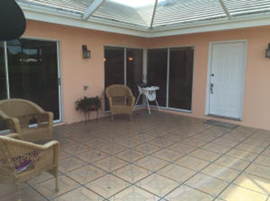 Beautiful upgraded 2 bedrooms 2 bathrooms villa with wood flooring, Both baths have been updated, Kitchen has Granite countertops. Patio area is beautiful. This villa also features a new roof. Assigned parking with 2 spaces up front. Close to Cotsco and schools.