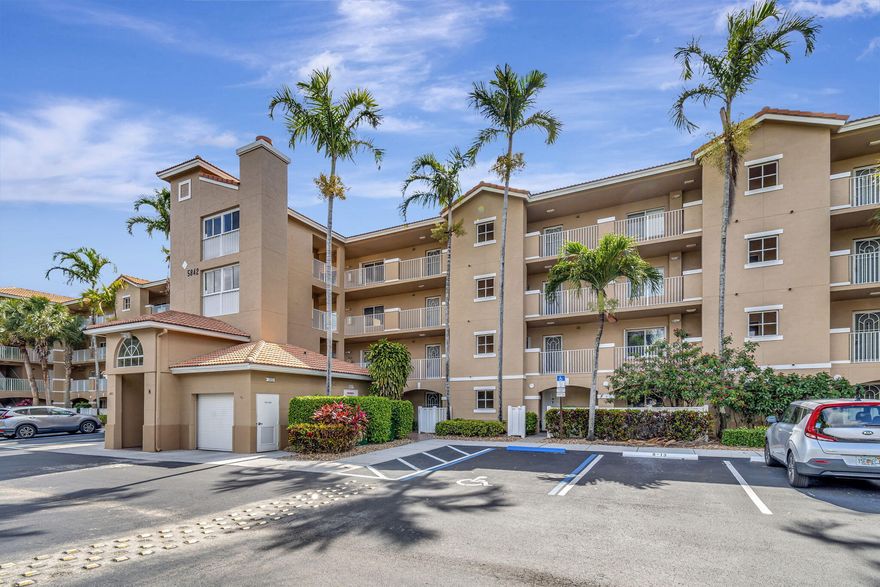 CORAL LAKES--SUPER ACTIVE ADULT COMMUNITY. Wow, what a fantastic ground-floor condo with a beautiful outdoor patio! This unique unit offers two bedrooms plus a Den with two full bathrooms and a convenient parking space right in front of the unit. We're Introducing The Chardonnay, a spacious condo model with an enchanting panoramic lake view. This ground-floor unit covers 1509 LivSqFt and has tiles throughout and carpet in both bedrooms, with no popcorn ceiling anywhere in the unit. The open-concept kitchen boasts granite countertops and backsplash and an eat-in area. The generously sized master bedroom offers a calming, gorgeous lake view, a renovated ensuite bathroom with a step-down shower, dual sinks, and an oversized walk-in closet. The Florida room includes a large closet with a mesmerizing lake view.  The maintenance fee includes water, sewer, cable, and internet, and the unit comes with an additional storage space closer to the satellite pool.  You can easily access the satellite pool, tennis and pickleball courts, and the clubhouse, all within walking distance.  The community boasts an impressive list of amenities, including 10 HAR TRU tennis courts, 6 pickleball courts, a recently renovated clubhouse, an 800-person theater, a cafe with both indoor and outdoor seating, a fitness center, indoor and outdoor pools, game rooms, craft rooms, and over 50 clubs.  RENTABLE FROM DAY 1, for a min. of 181 days, once every 12 months.  Service or Emotional Support animals ONLY.  At least one occupant must be 55 or older, while no occupants under 19 are allowed.  Owners are required to purchase a cafe card each January.  A/C--2023 with UV Light for mold prevention, HWH-2017, Parking Spot-8-13.