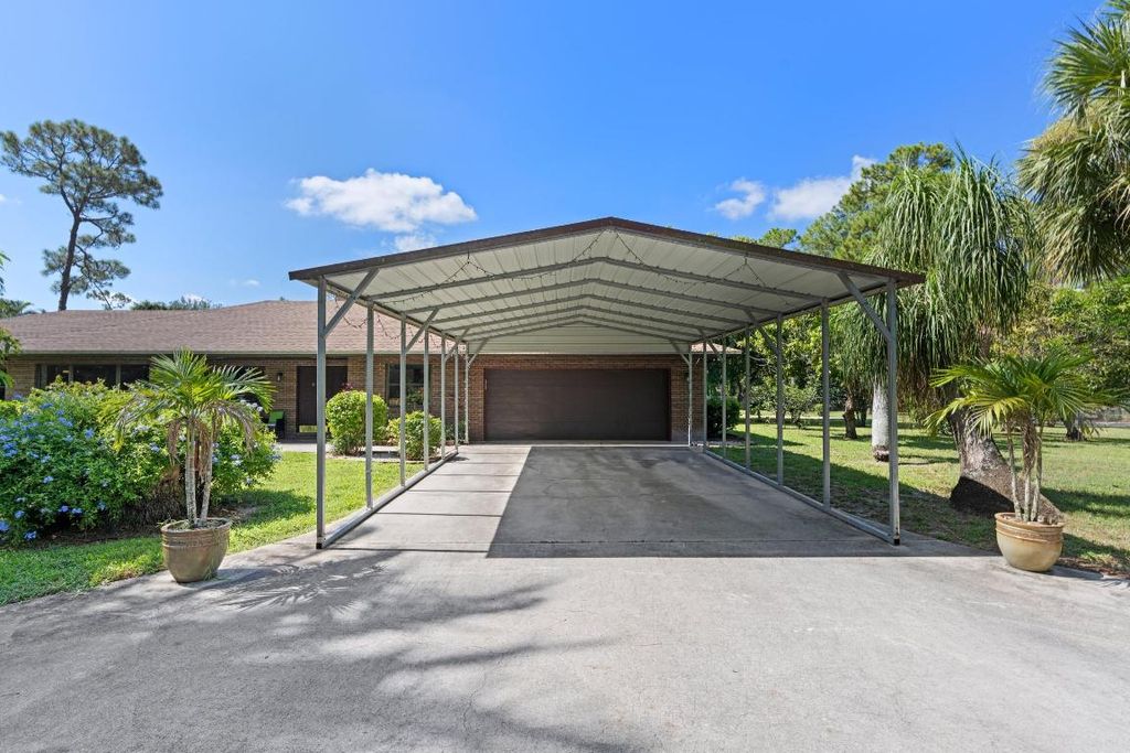 Photo of 12874 Bryan Road, Loxahatchee Groves, FL 33470 (MLS # R11112493)