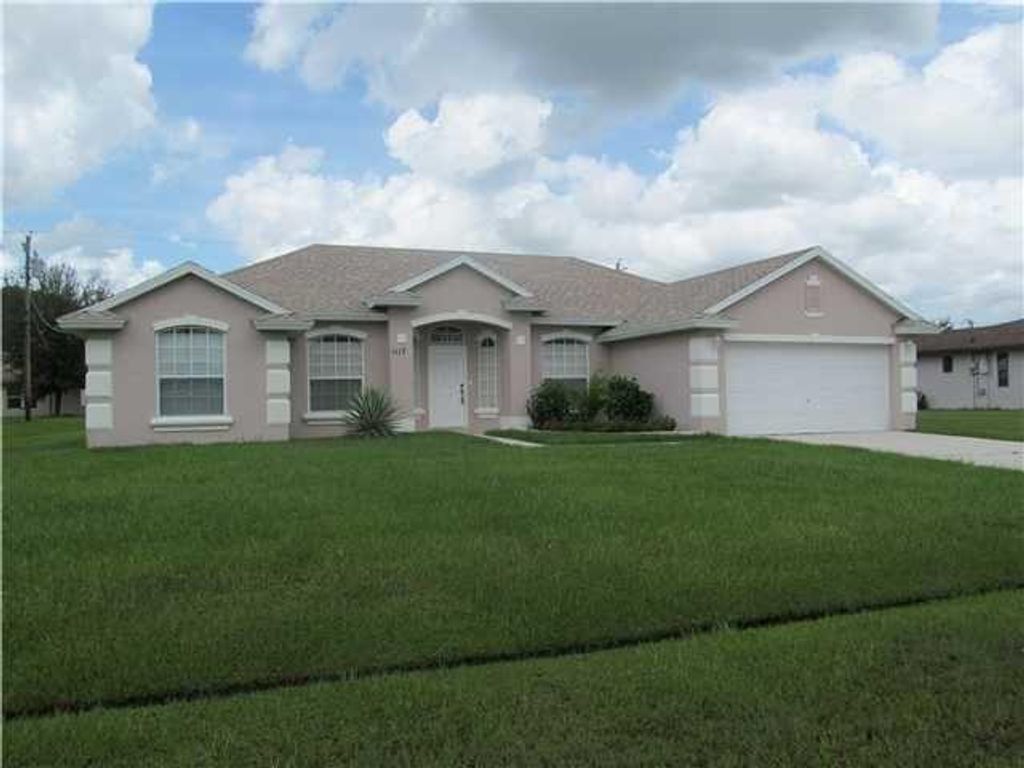 Photo of 1117 SW Jennifer Avenue Ave, Port St Lucie, FL 34953 (MLS # R10797827)