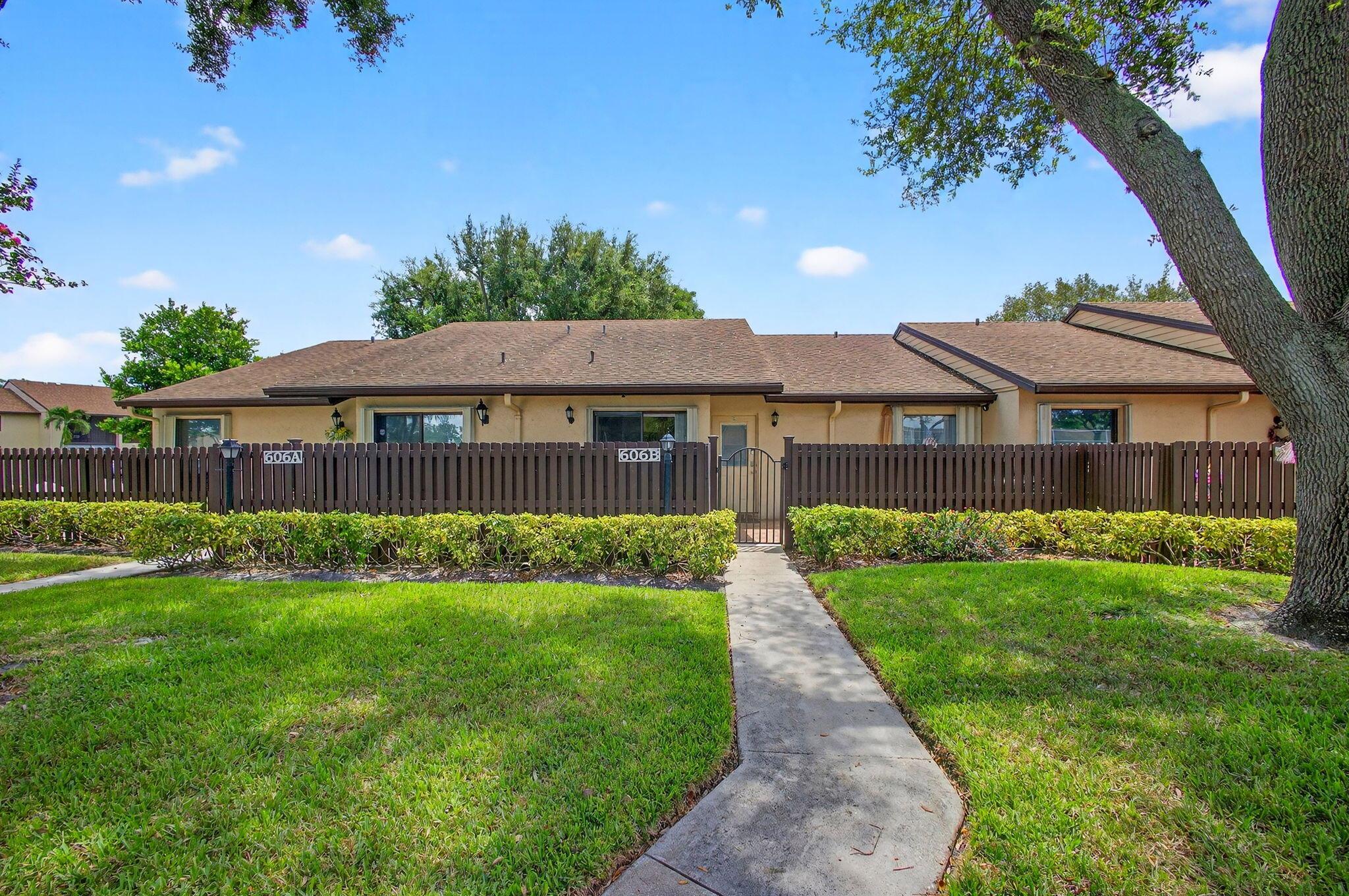 Charming and beautifully maintained 2-bedroom, 2-bath + Office villa in the desirable community of Pine Ridge North, Greenacres. Situated on a tranquil small lake, this home combines comfort and convenience with a touch of modern style.Inside, you'll find an open floor plan with vaulted ceilings creating a bright, airy feel, Granite countertops & stainless-steel appliances in the kitchen with wood cabinetry, Tile flooring throughout for easy care and timeless appeal, a laundry room with storage, a back room perfect for a home office or flex space! Outdoor living is easy with both a front and rear patio, ideal for morning coffee or evening relaxation while enjoying the lake view. Residents of Pine Ridge North can enjoy the amenities including a community pool, clubhouse, tennis court