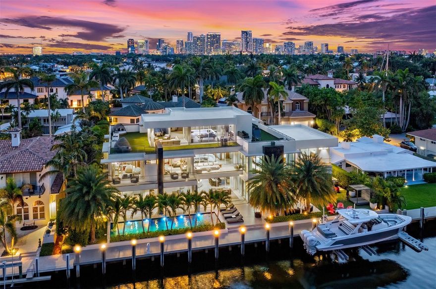 Welcome to 650 Royal Plaza. Sleek, modern, and unapologetically sexy, this 3-story Las Olas Isles estate is a masterclass in contemporary design. Boasting over 9,200 SF, it features a rare 131' of prime water frontage on an oversized lot. Designed for high-end entertaining, 650 has it all. Including a lap pool with spa, summer kitchen with AC, third-floor club room and roof deck with a wet bar, a sauna, steam shower and breathtaking sunrise-to-sunset views. The smart home includes 7 beds, 9.5 baths, a custom elevator, 3 fireplaces, 7-zone A/C & a full in-law/staff suite. The Italian kitchen dazzles with Sub-Zero & Wolf appliances. The expansive Primary Suite features a sitting area, morning bar, private balcony, vast dual walk-in closets and a spa-like bath. Bold. Luxurious. Unforgettable.