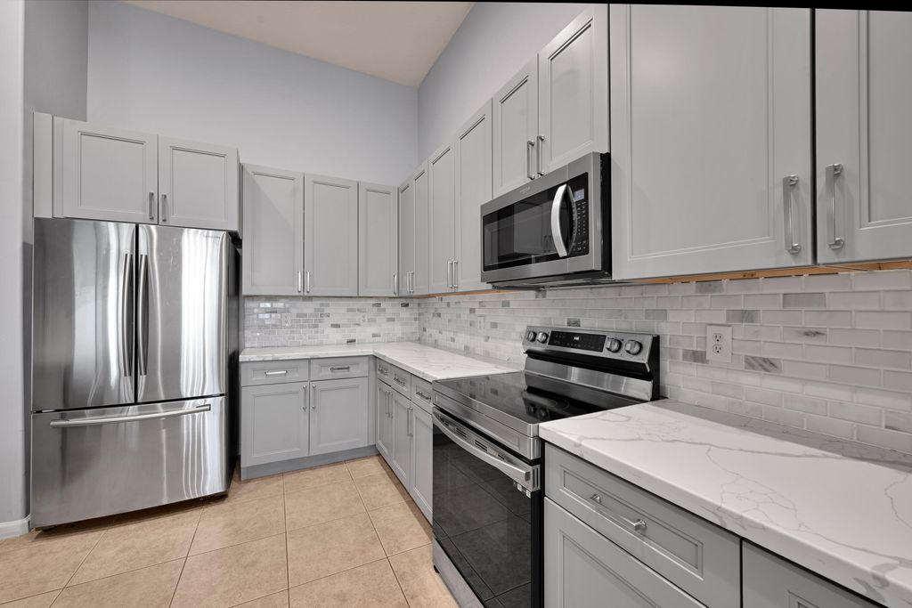 Photo of 9357 Osprey Isles Boulevard, West Palm Beach, FL 33412 (MLS # B26025253)
